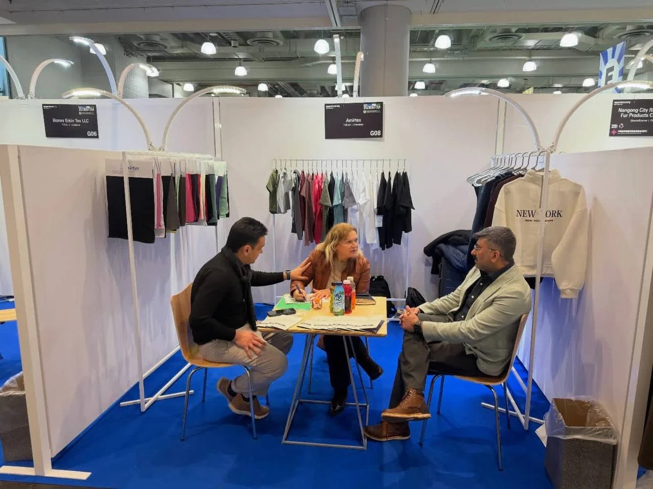 Amirtex team meeting buyers at booth G08 during Texworld New York City 2026