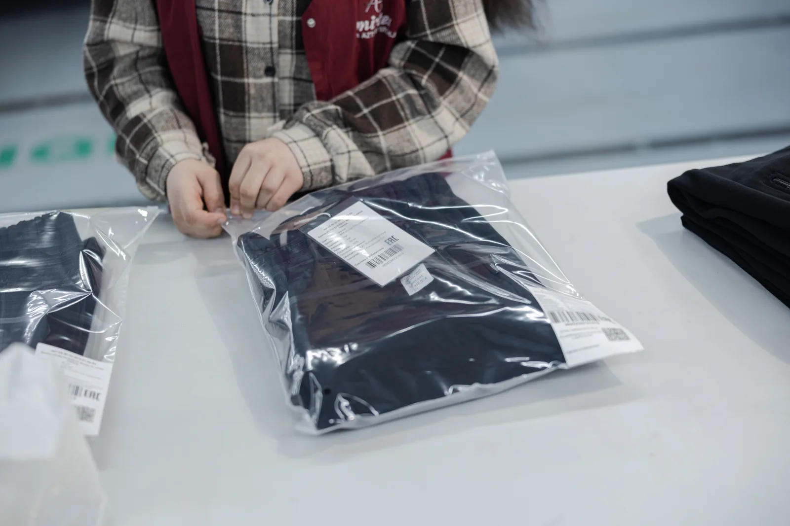 Final inspection and retail-ready packing area at Amirtex